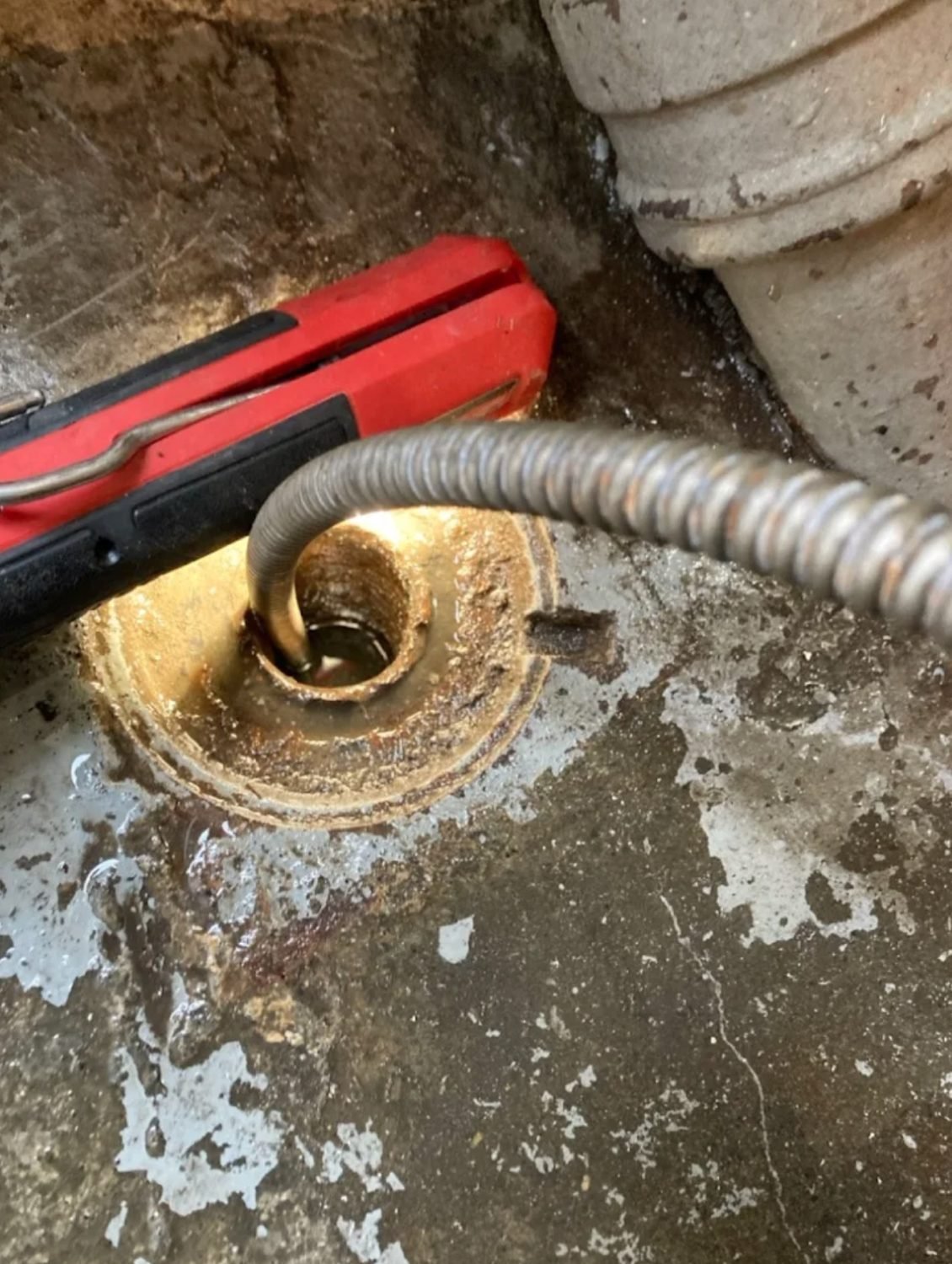 Drain cable fed into a commercial floor drain