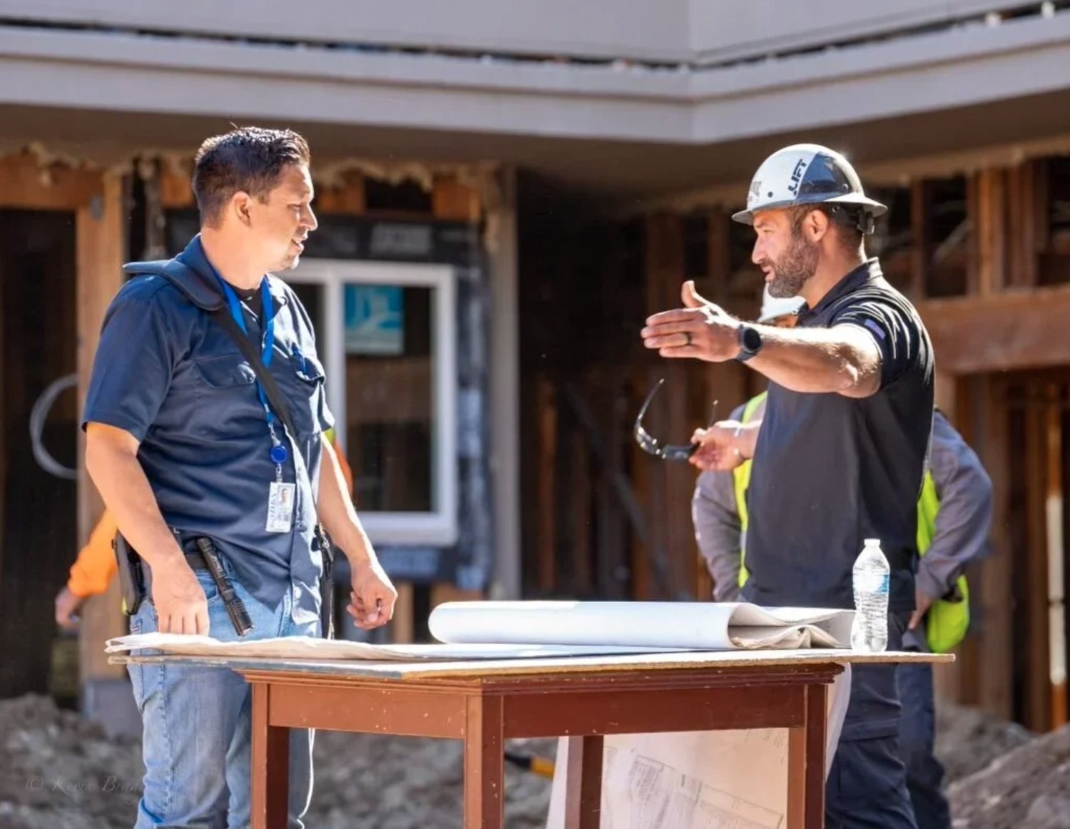 Two of our people going over drawings on site with the trades