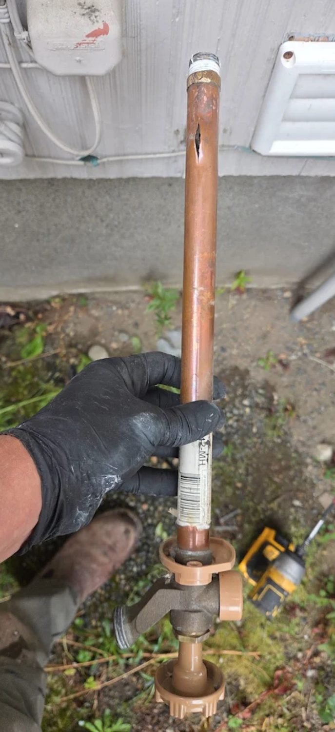 Split section of copper pipe removed from a hose bib line