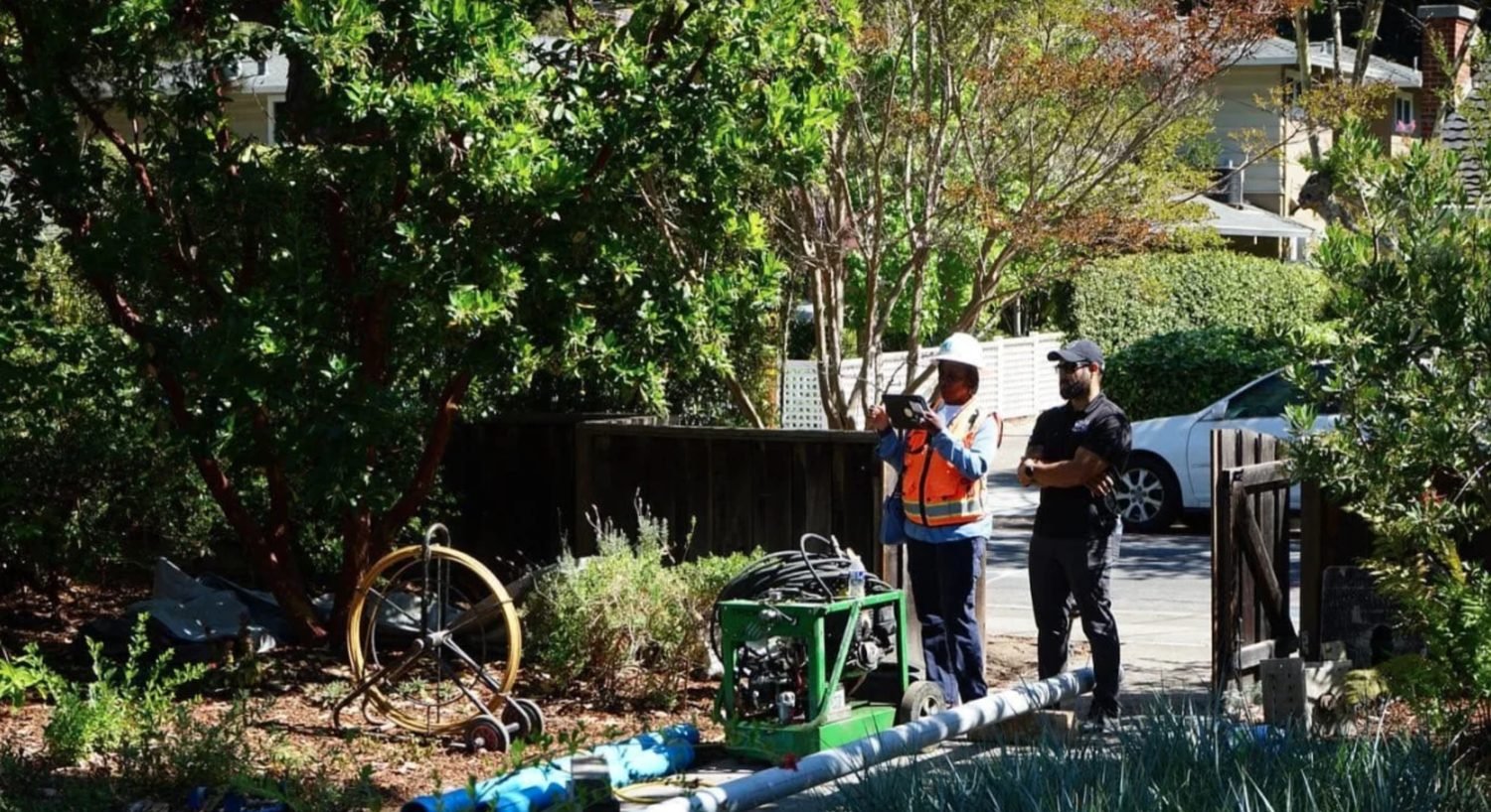 Our team going over the work with a homeowner in their front yard